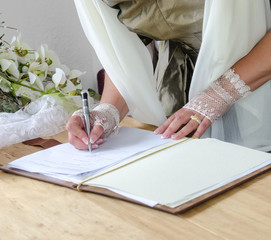 Wedding signature: Bride signing marriage license