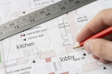 Man working on technical drawing