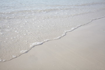 Wave of the sea on the sand beach