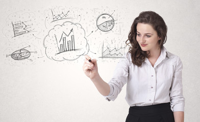 Young lady sketching financial chart icons and symbols