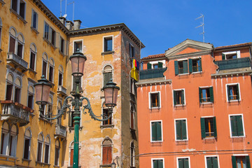 Fototapeta na wymiar Facades of houses on a street in Venice, Italy