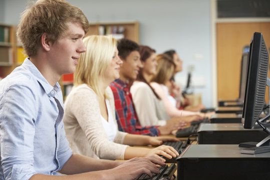 Students working on computers in library