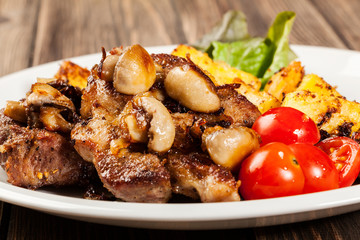 Fried pork chop with mushrooms and chips