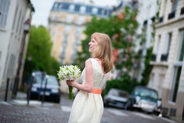 Fototapeta premium Beautiful bride on a street ofMontmartre in Paris