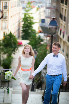 Happy young newly-wed couple on Montmartre