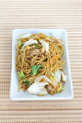 Chinese food stir - fried noodles with pork and vegetables