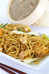 Chinese food stir - fried noodles with pork and vegetables