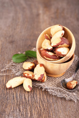 Tasty brasil nuts on wooden background