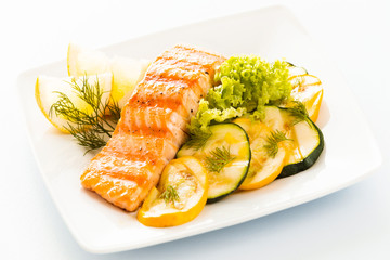 Salmon steak with zucchini and courgette
