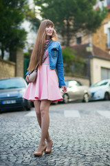 Beautiful girl in pink dress on Montmartre