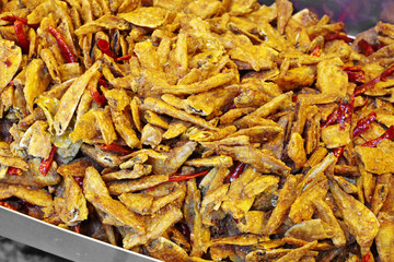 close up spicy fish fried in market