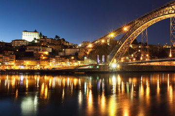 Fototapeta na wymiar Dom Luis bridge and Porto at dusk