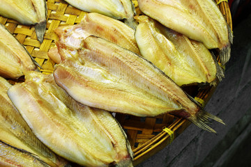close up thai dry fish on wooden plate