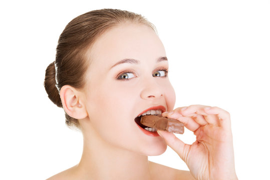 Young Beautiful Woman Eating Bar