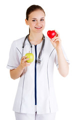 Smiling doctor with a green apple and red heart.