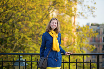 Beautiful young girl in Paris on a fall day