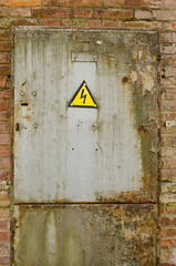 door with yellow warning sign of danger