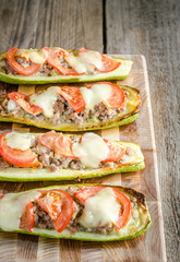 Stuffed zucchini on the wooden board