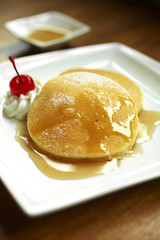 close up pancake and syrup in morning light