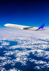 Obraz na płótnie Canvas aeroplane. Airplane over the mountains