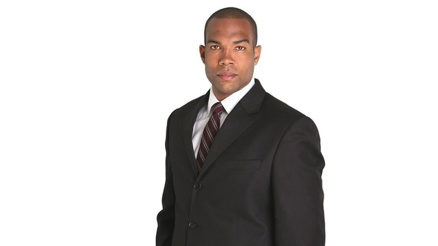 Portrait of executive standing and uncrossing arms