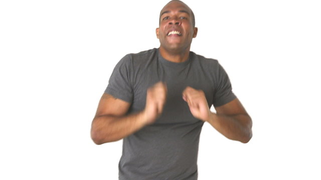 Young man in jeans and t-shirt dancing