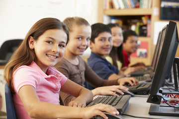 Fototapeta na wymiar Schoolchildren working on computers