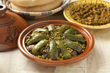 Moroccan dish with lamb, peas and courgette