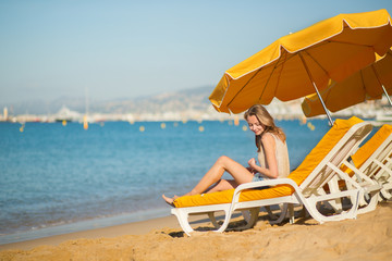 Beautiful girl relaxing on a beach chair