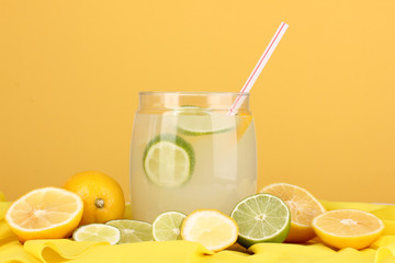 Citrus lemonade in glass bank of citrus around