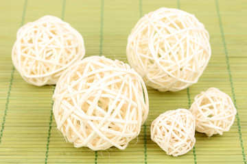 wicker bamboo balls on bamboo mat