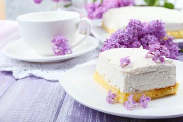 Delicious dessert with lilac flowers