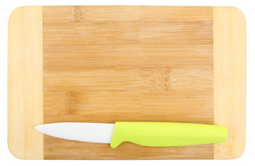 Kitchen knife and cutting board isolated on white