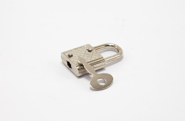 Padlock with key in white isolate