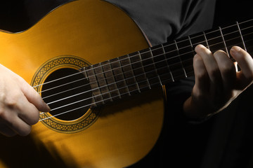 Fototapeta na wymiar Acoustic guitar hands close up