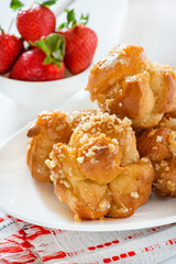 Profiteroles with nuts and strawberries