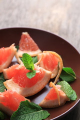 Ripe chopped grapefruit with mint leaves