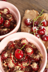 Tasty cherry dessert on table