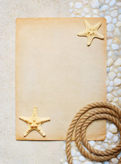 Blank sheet of paper on the sea sand for beach party