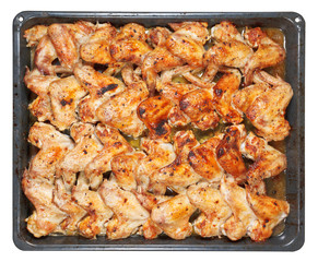 many roasted spicy chicken wings on tray isolated