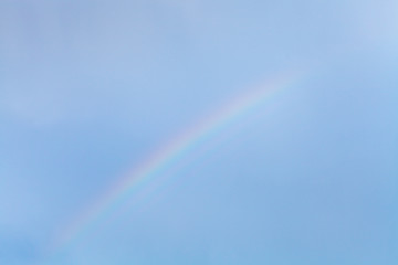 rainbow in blue sky