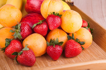 Ripe strawberries and apricots