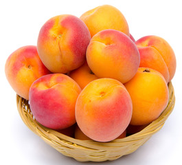 Naklejka na ściany i meble Mound of apricots in a basket
