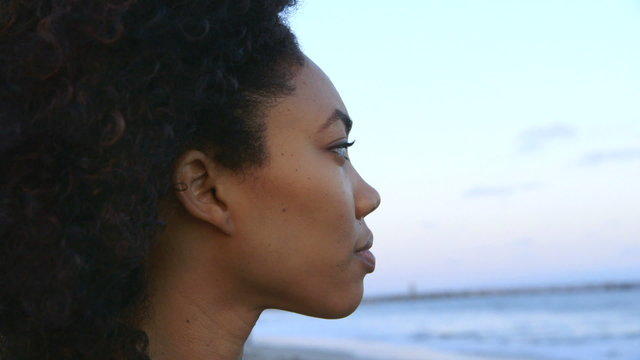 Portrait of woman looking out over the ocean