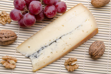 French Morbier cheese on a straw placemat