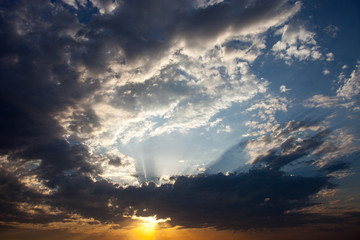 Cloudscape with the sun rays radiating from behind the cloud