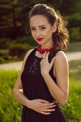 Elegance portrait of charming lady in black dress