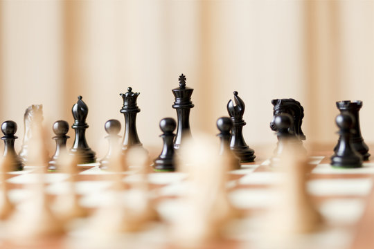 Chess pieces set on a chessboard