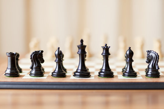 Chess pieces set on a chessboard