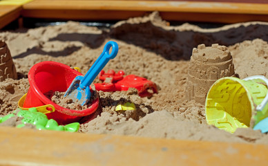 Pit sand with plastic toys